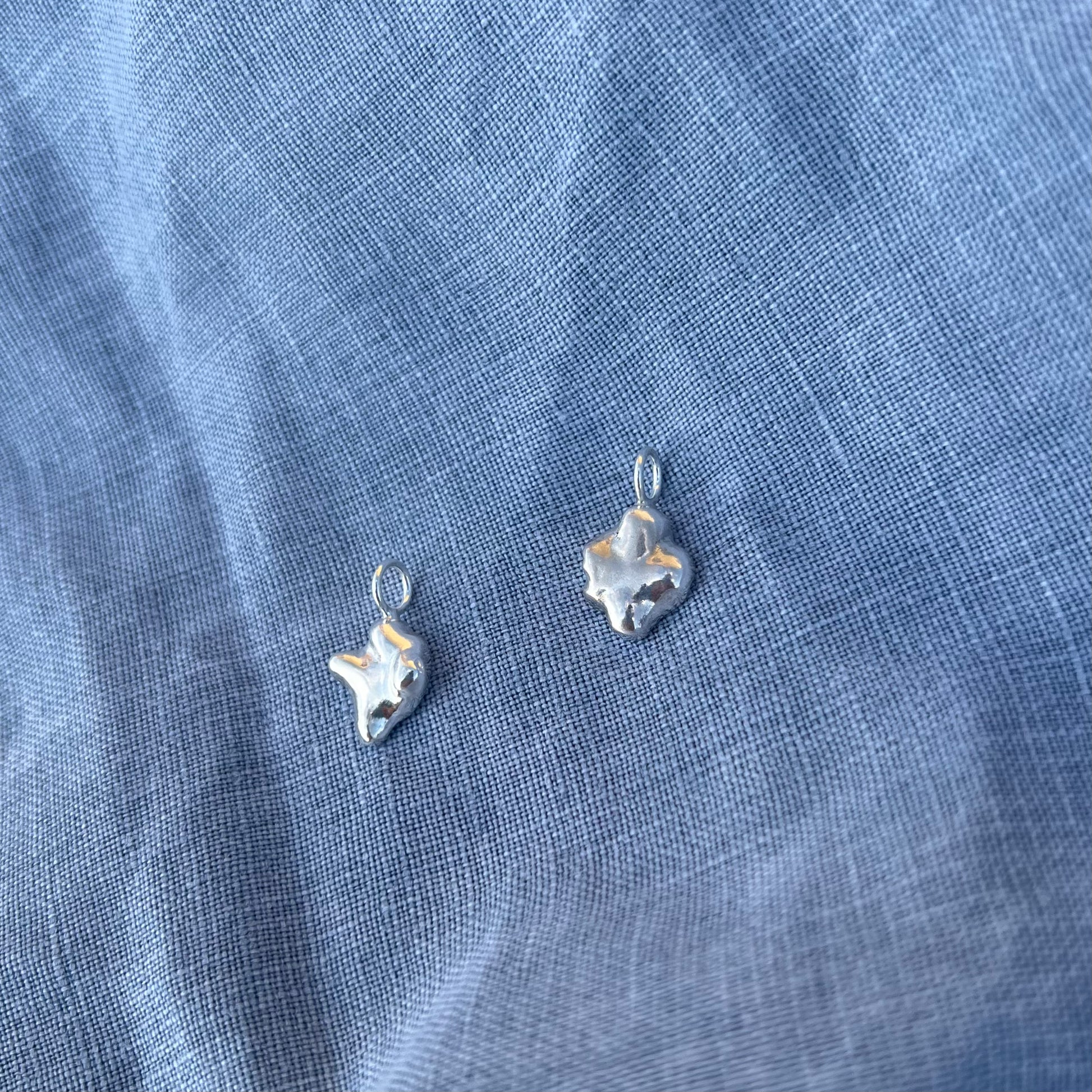 The swirl & swell pendants in sterling silver.
